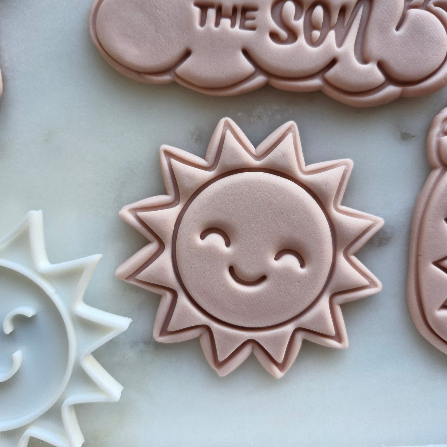 Sun Cookie Cutter and Emboss Stamp - Baking Tool, zoomed out marble baCkground Here Comes the Son Set Cookie Cutter and Emboss Stamp - Baking Too lHere Comes the Son Set Cookie Cutter and Stamp Baking Tool
