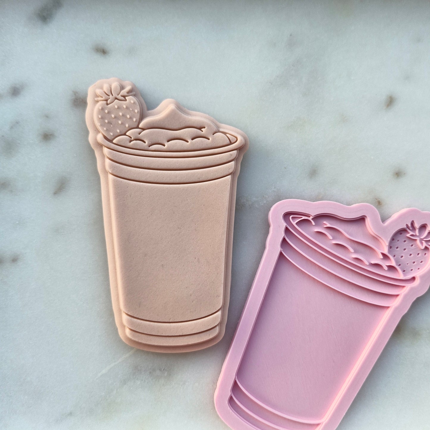 Strawberry Drink Cookie cutter and Stamp zoomed out on white marble stone