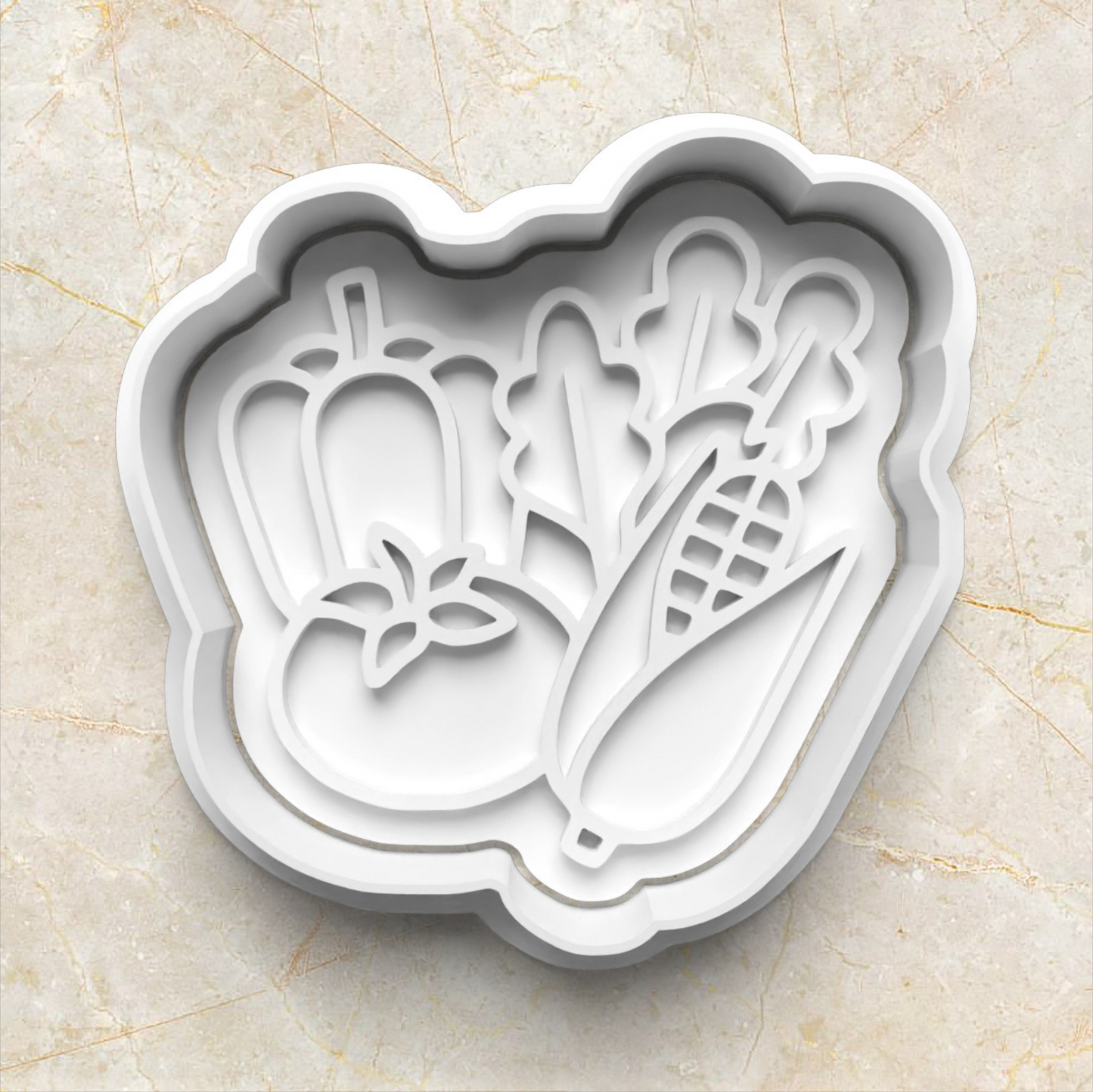 White cookie cutter and stamp with vegetable designs on a beige marble background Farmer's Market Cookie Cutter and Emboss Stamp